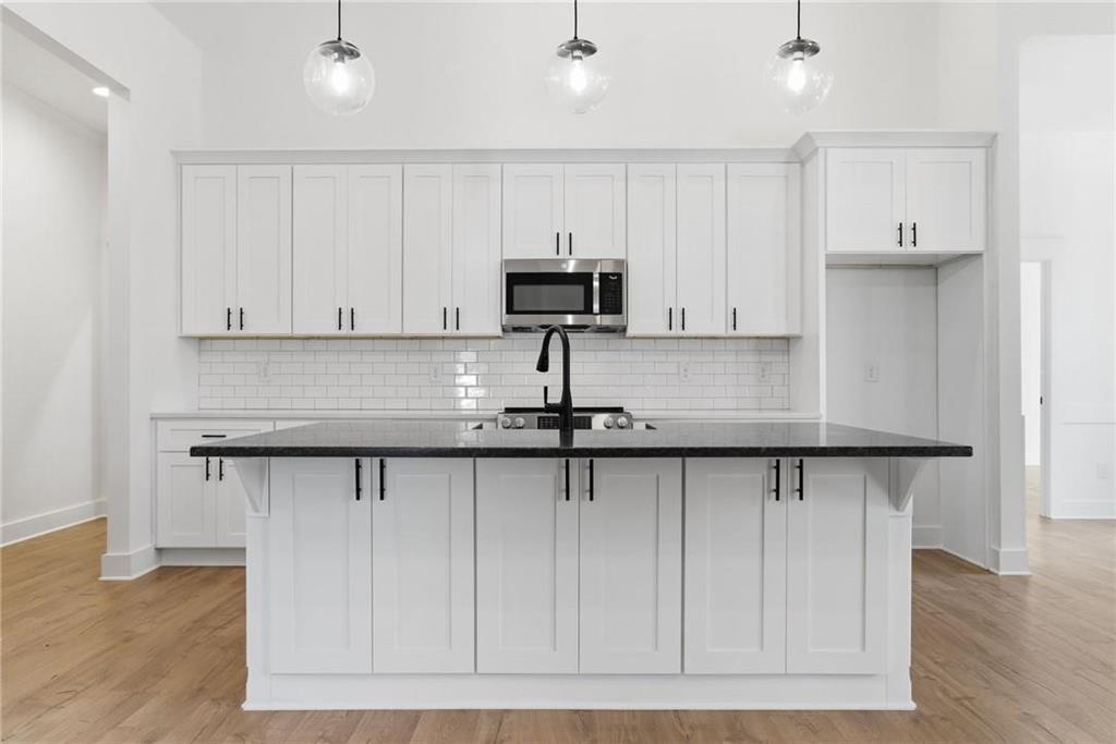 170 Field Stone Circle Jasper, GA 30143 - Photo 6 of 34 a kitchen with a sink and cabinets