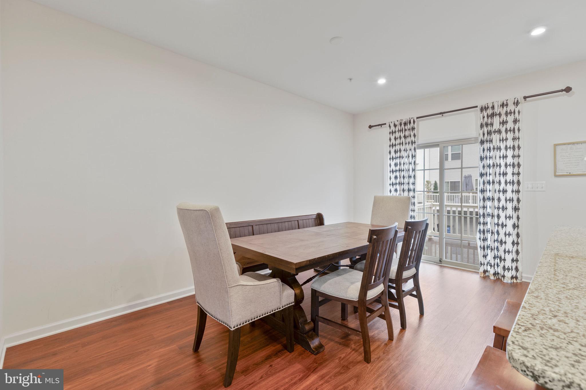 10020 Sandy Run Road Baltimore, MD 21220 - Photo 5 of 19 a view of a dining room with furniture and wooden floor