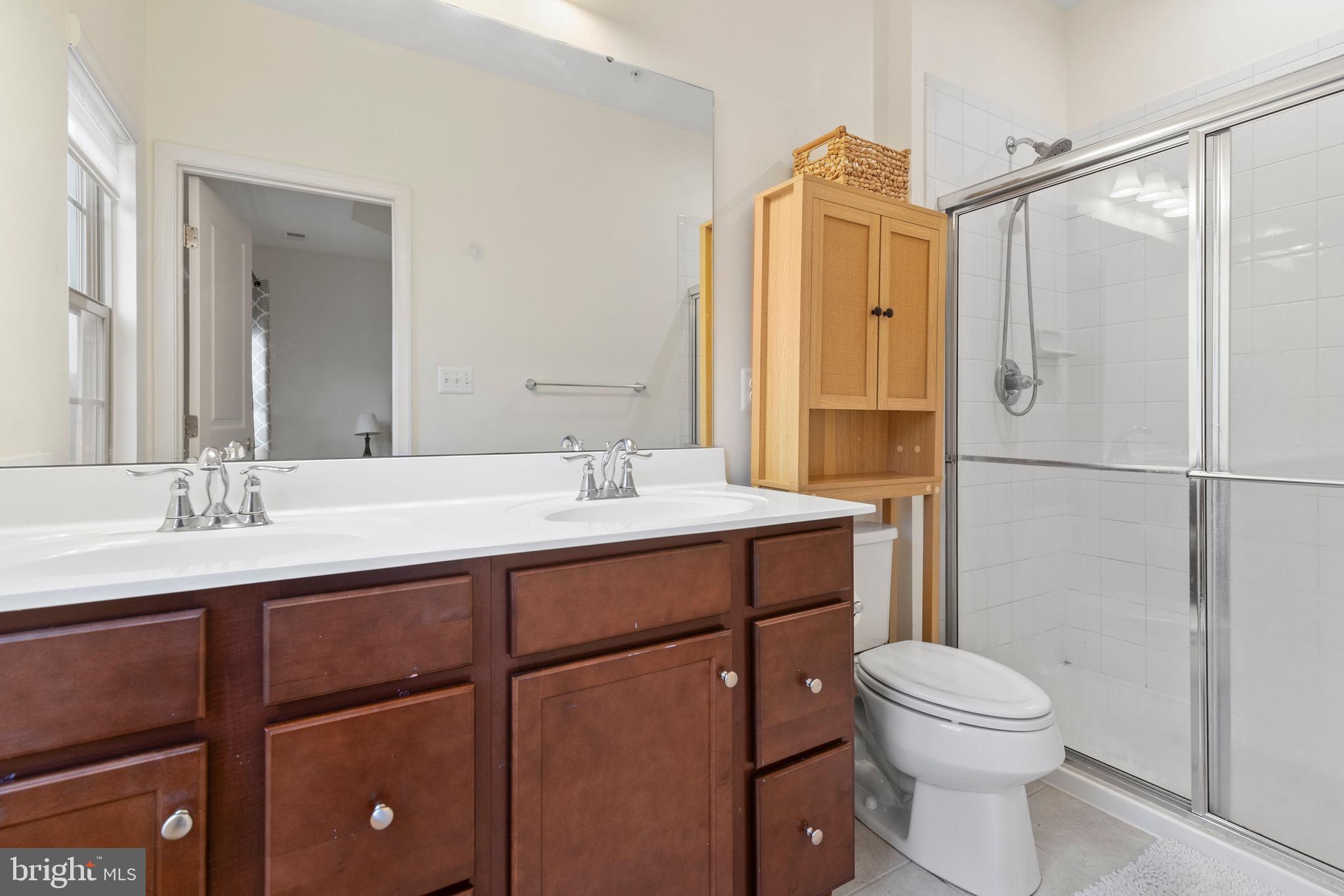 10020 Sandy Run Road Baltimore, MD 21220 - Photo 9 of 19 a bathroom with a sink a toilet and shower