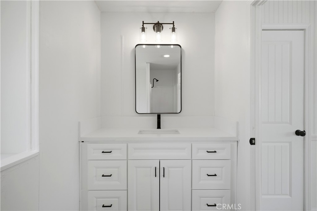 59995 Granite Gulley Road Anza, CA 92539 - Photo 21 of 33 a bathroom with a sink and a mirror