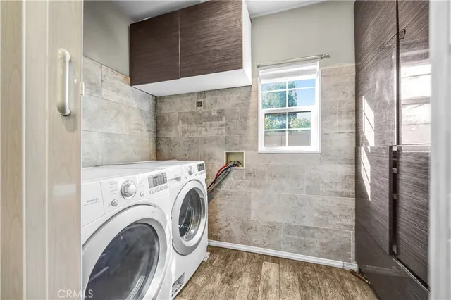 a view of livingroom with washer and dryer
