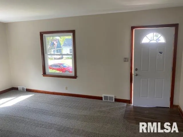 a kitchen with a sink cabinets and window