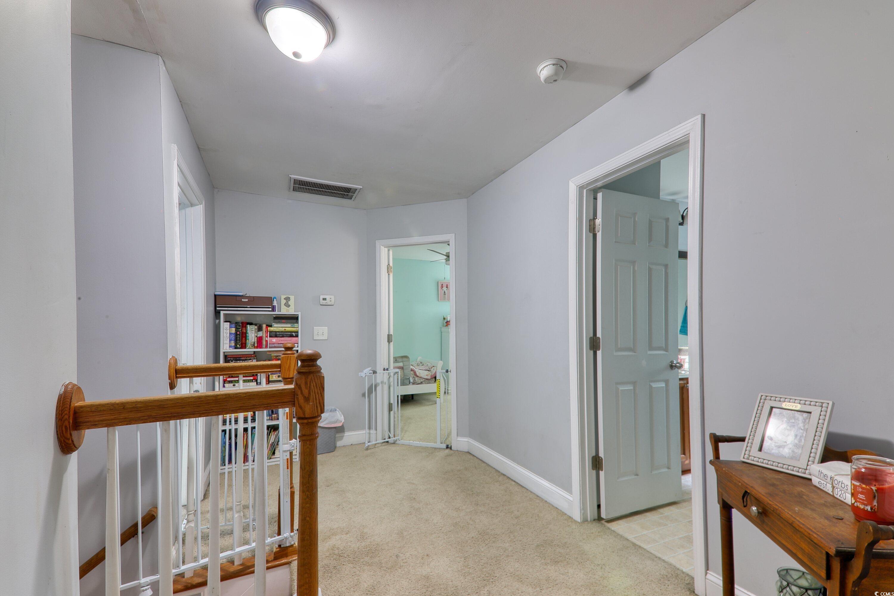 190 Hamilton Way Conway, SC 29526 - Photo 13 of 35 Corridor with light colored carpet, baseboards, an