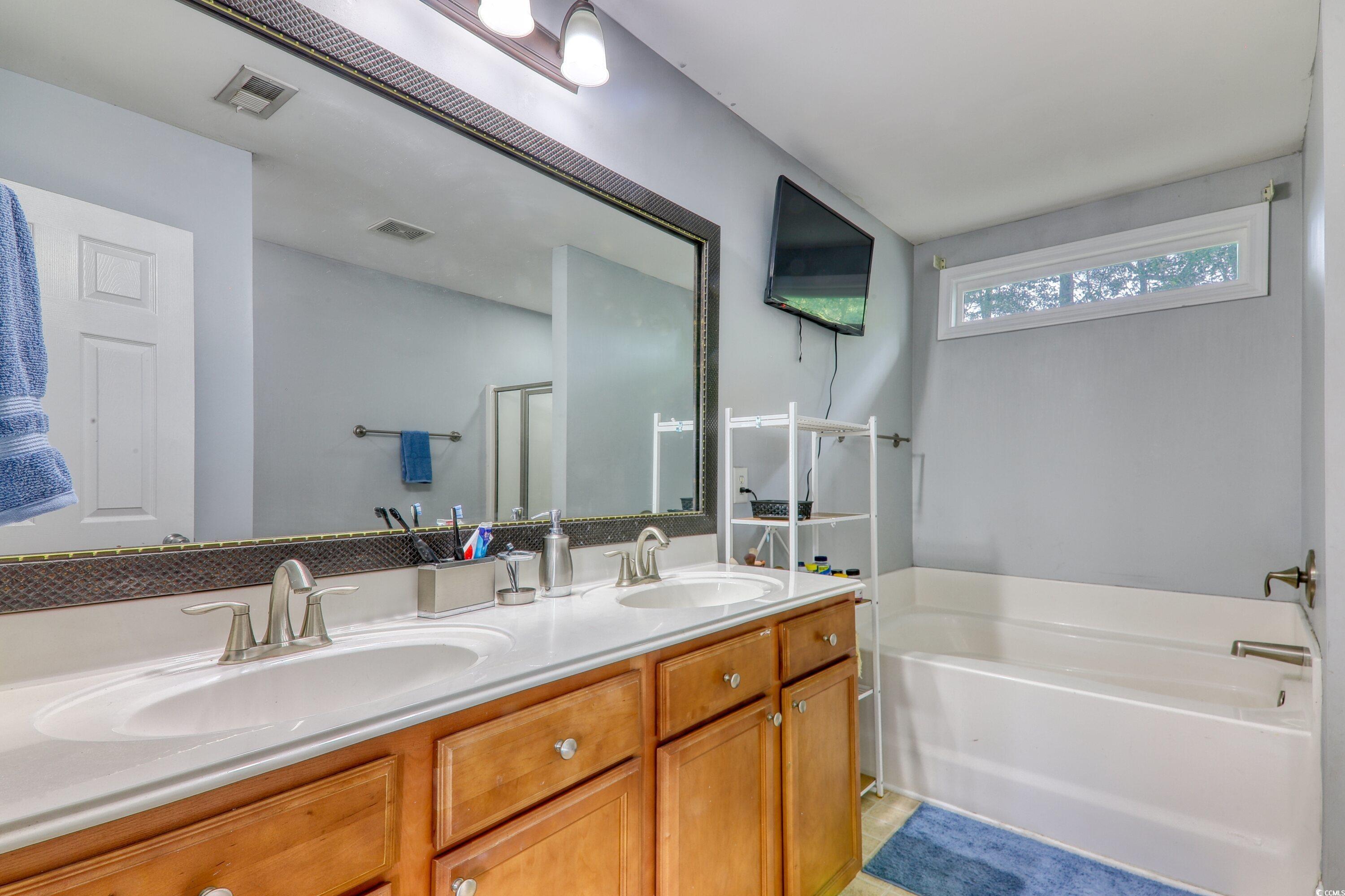 190 Hamilton Way Conway, SC 29526 - Photo 27 of 35 Full bath with a bath, visible vents, a sink, and