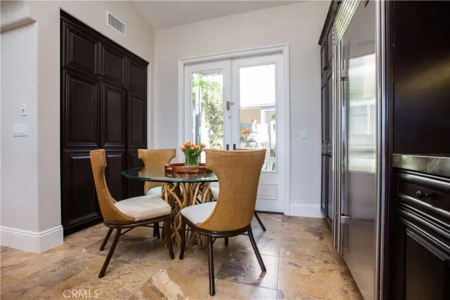 a view of a dining room with furniture and a window