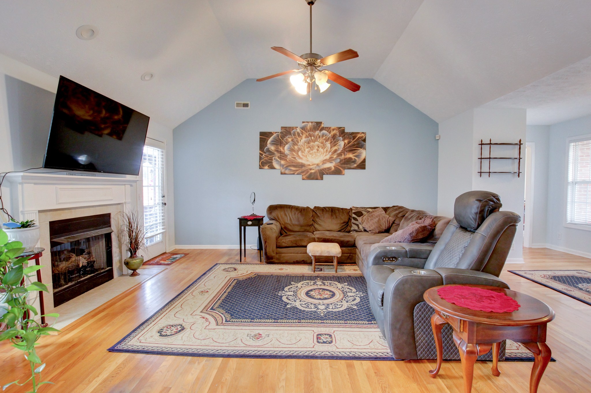 244 Cheshire Road Clarksville, TN 37043 - Photo 14 of 84 a living room with furniture a flat screen tv and a fireplace