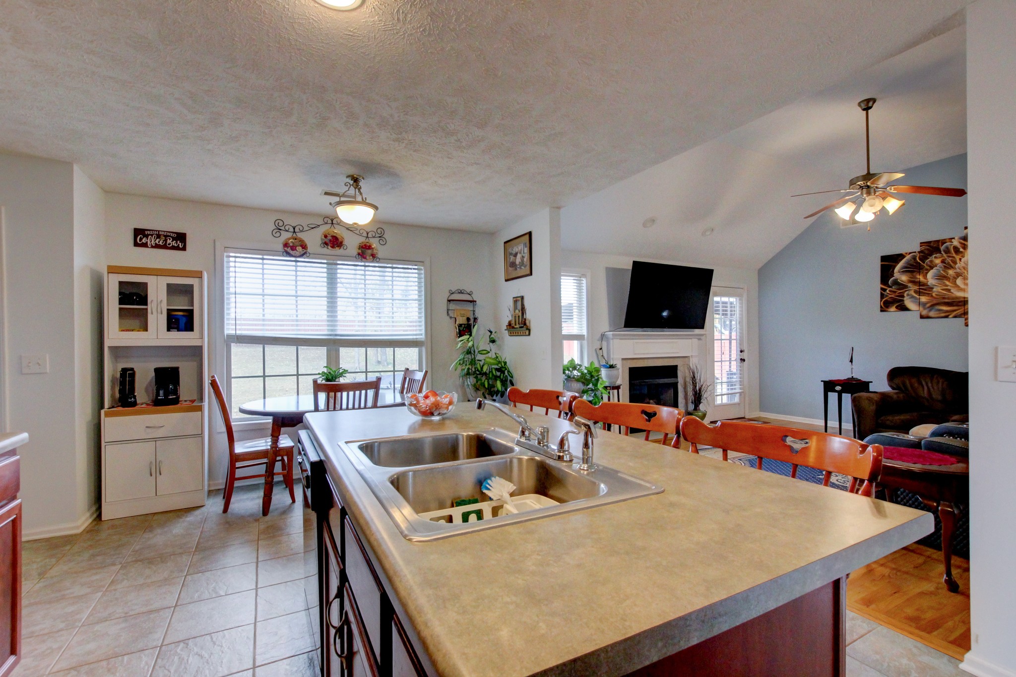 244 Cheshire Road Clarksville, TN 37043 - Photo 28 of 84 a kitchen with a table chairs and a refrigerator