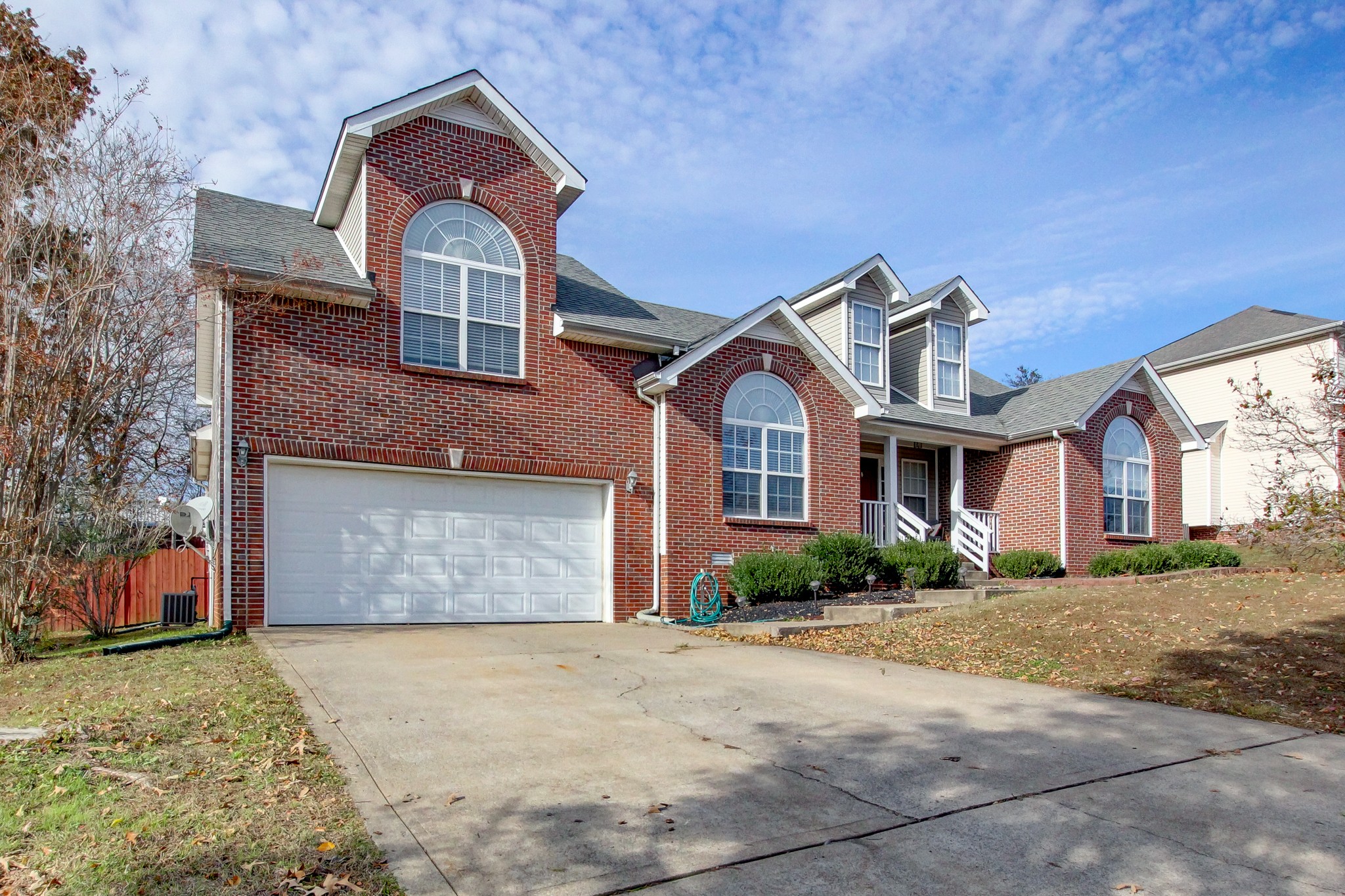 244 Cheshire Road Clarksville, TN 37043 - Photo 5 of 84 a front view of a house with a yard and garage