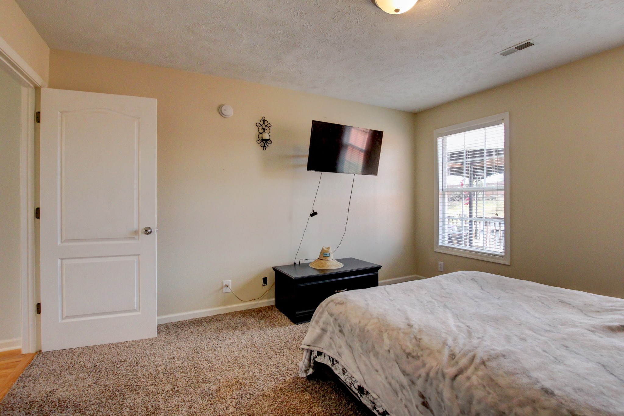 244 Cheshire Road Clarksville, TN 37043 - Photo 62 of 84 a bedroom with a bed and flat screen tv