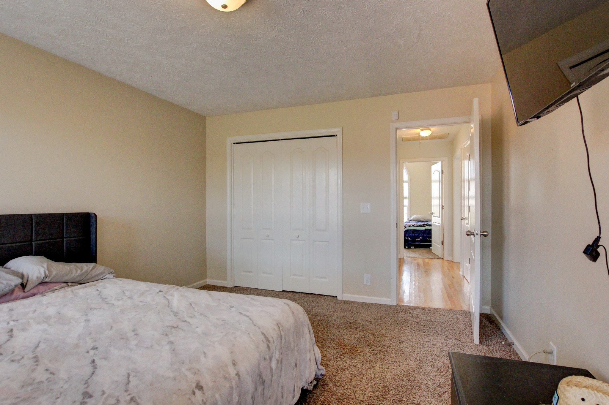 244 Cheshire Road Clarksville, TN 37043 - Photo 63 of 84 a bedroom with a bed and a view of bathroom