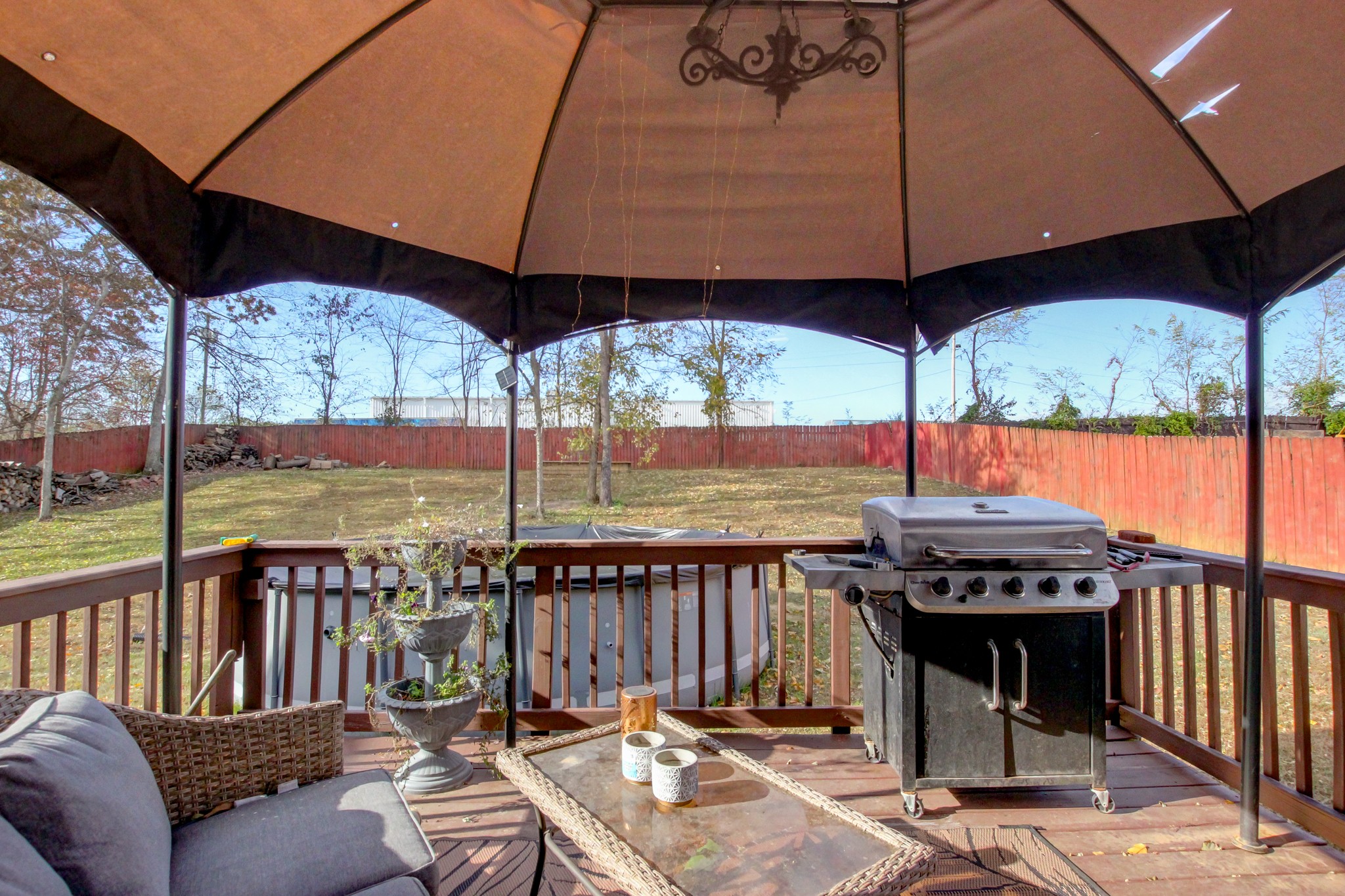 244 Cheshire Road Clarksville, TN 37043 - Photo 76 of 84 a view of a patio with a table chairs under an umbrella