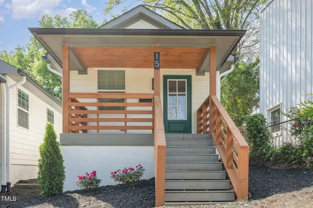 a front view of a house with wooden fence