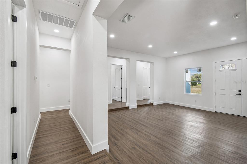 310 Waterfall Drive Spring Hill, FL 34608 - Photo 17 of 40 a view of a hallway with wooden floor