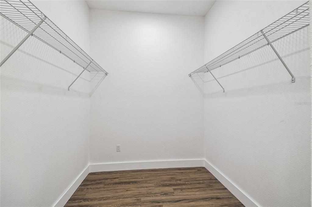 310 Waterfall Drive Spring Hill, FL 34608 - Photo 30 of 40 a view of a room with racks on the wall