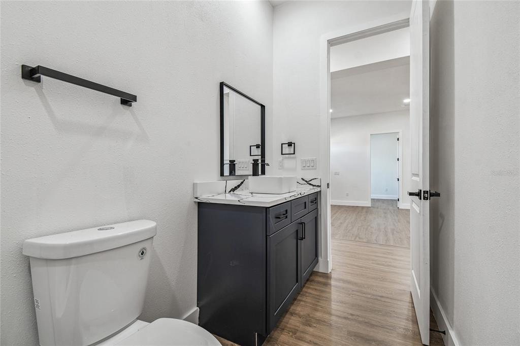 310 Waterfall Drive Spring Hill, FL 34608 - Photo 34 of 40 a bathroom with a sink toilet and shower