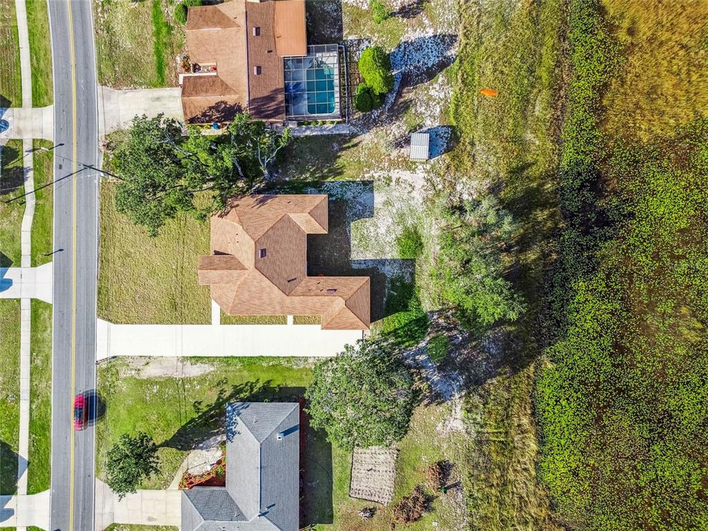 310 Waterfall Drive Spring Hill, FL 34608 - Photo 40 of 40 an aerial view of a house with a yard and large trees