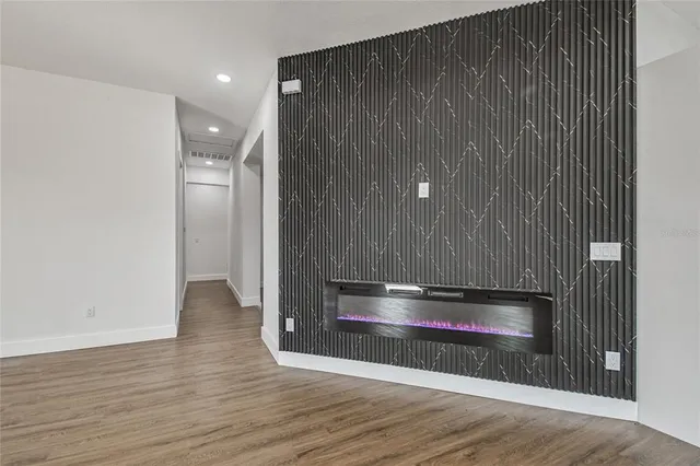 a view of wooden floor and brick wall