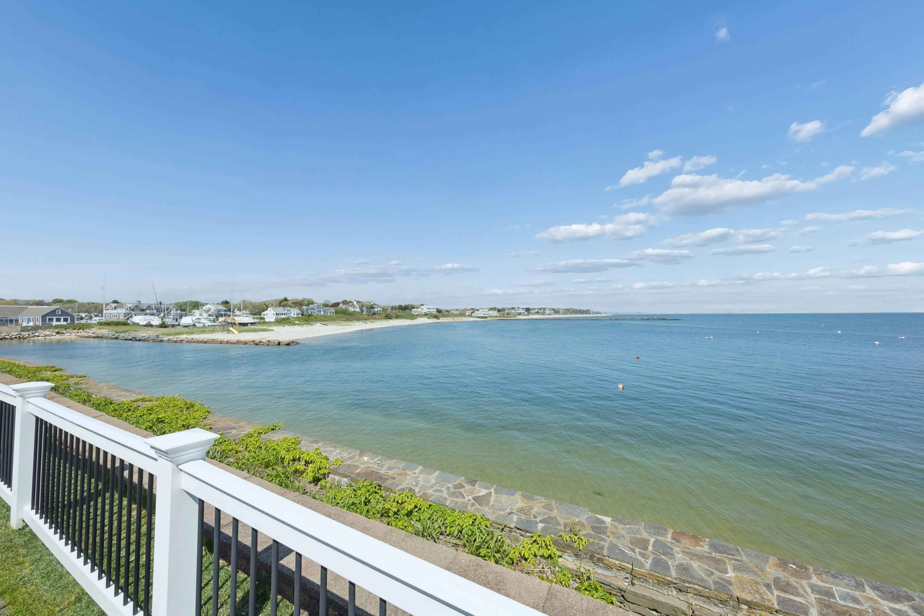 23 Snow Inn Road, Unit 7 Harwich Port, MA 02646 - Photo 32 of 37 a view of a lake from a balcony