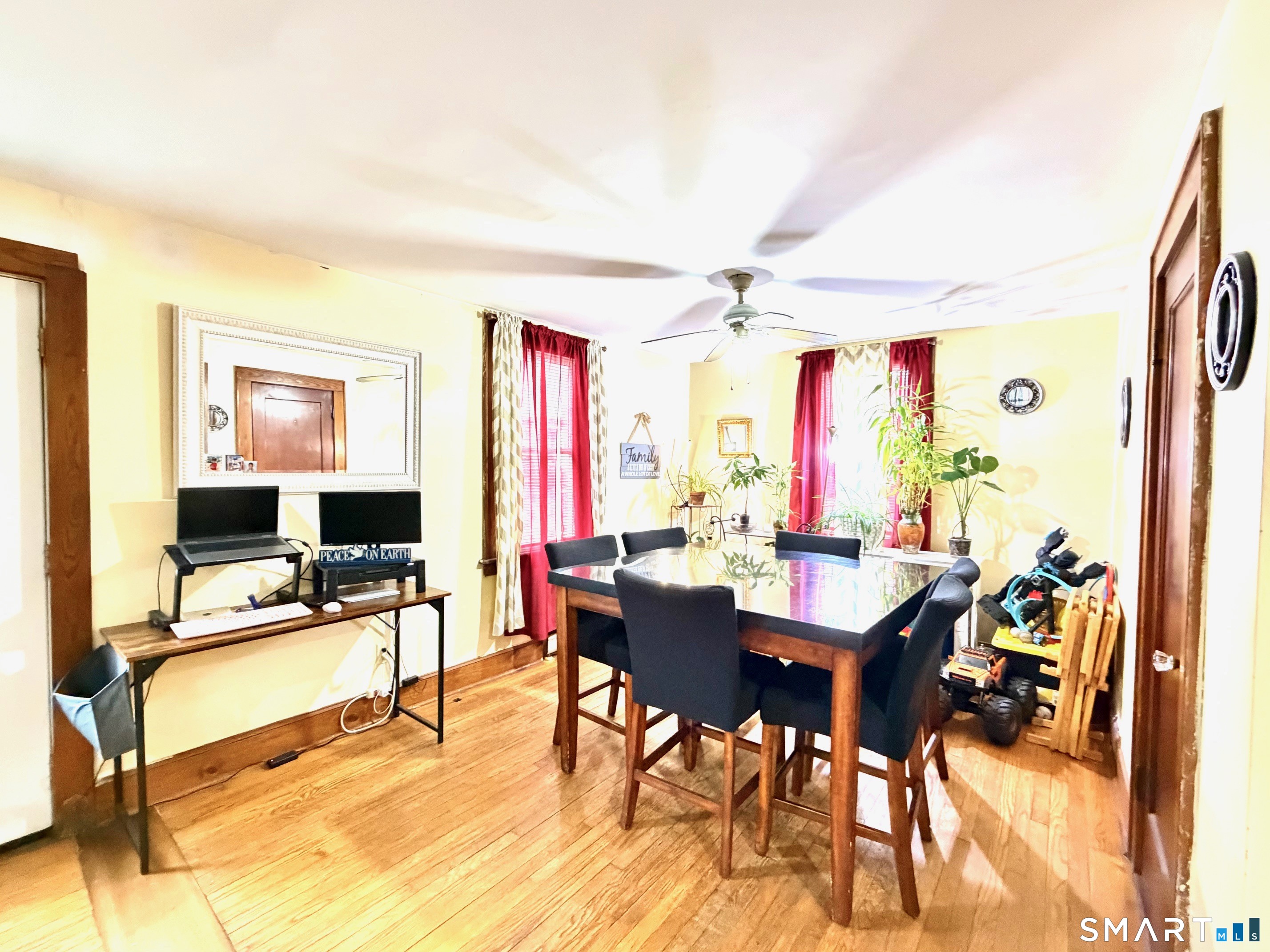 24 Byron Avenue Ansonia, CT 06401 - Photo 6 of 21 a view of a livingroom with furniture and a flat screen tv