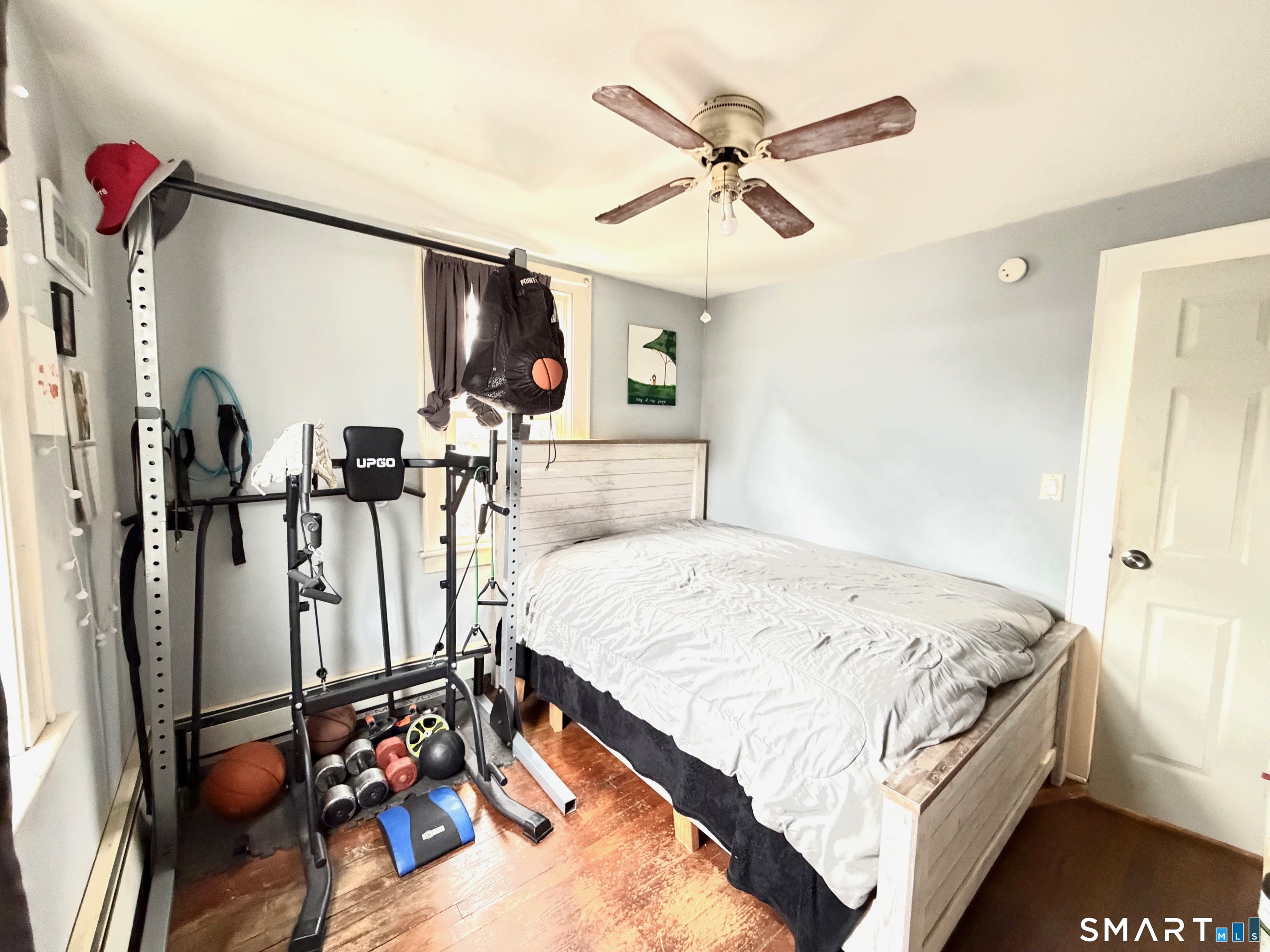 24 Byron Avenue Ansonia, CT 06401 - Photo 10 of 21 a bedroom with bed mirror and window