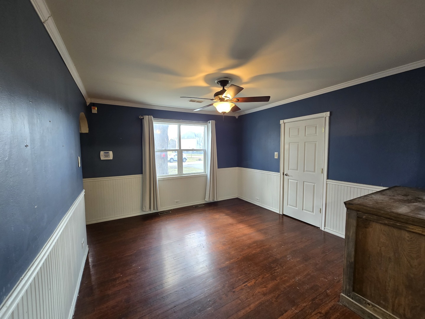 16517 Plainview Drive Markham, IL 60428 - Photo 2 of 30 a view of an empty room with a window and wooden floor