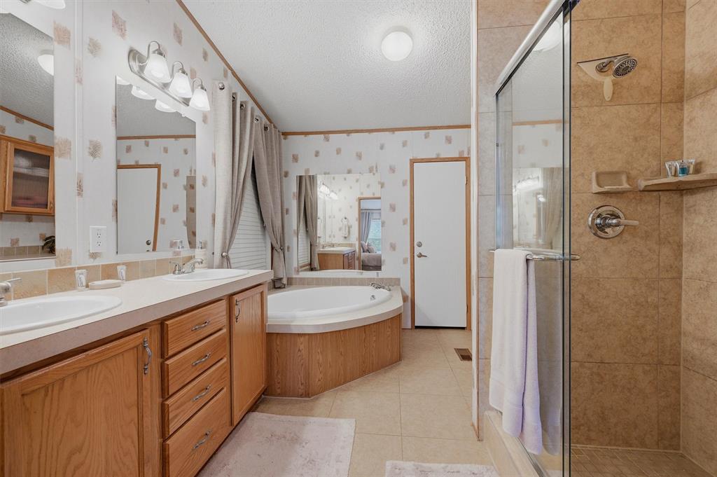 212 Sunset Road Pottsboro, TX 75076 - Photo 15 of 40 a spacious bathroom with a double vanity sink mirror double and shower