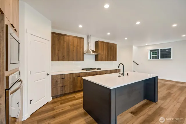 a kitchen with a sink and stove