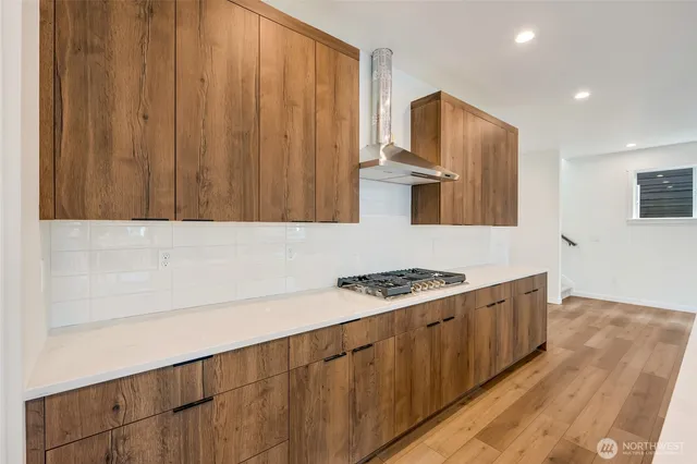 a kitchen with stainless steel appliances a stove and a refrigerator