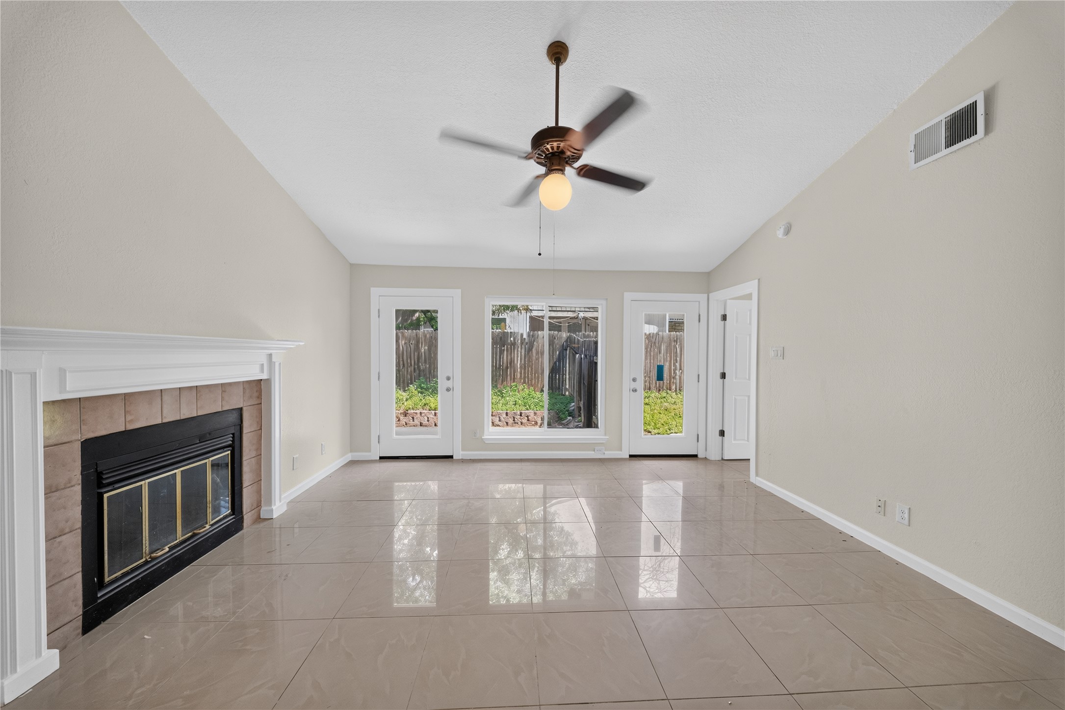 339 Fantail Loop, Unit B Austin, TX 78734 - Photo 13 of 21 a view of an empty room with window and fireplace