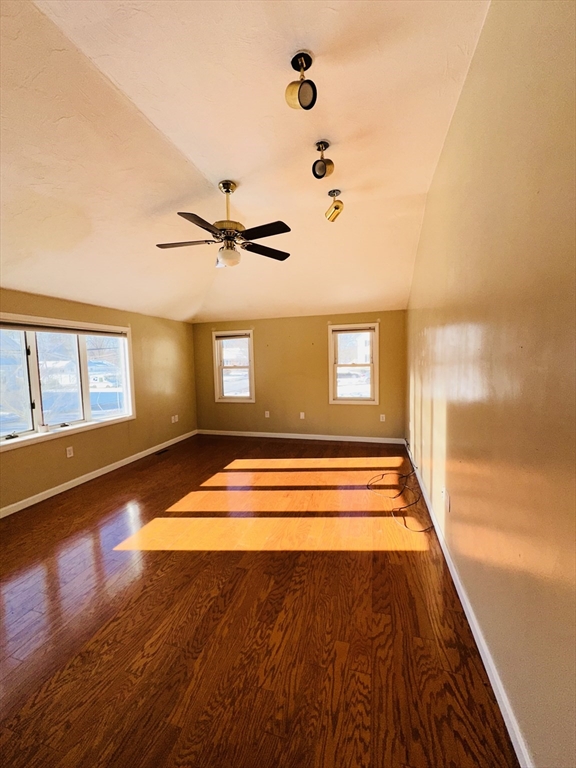 82 East High Street, Unit 1 Avon, MA 02322 - Photo 18 of 21 a view of a room with wooden floor and windows