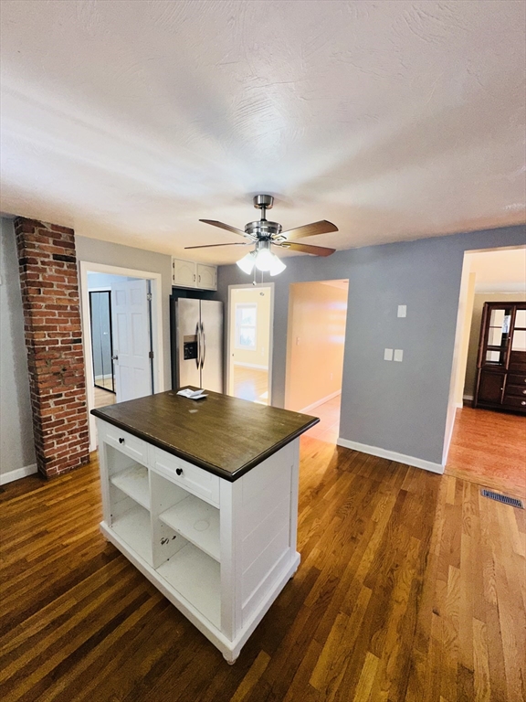82 East High Street, Unit 1 Avon, MA 02322 - Photo 4 of 21 a kitchen with wooden floor and window