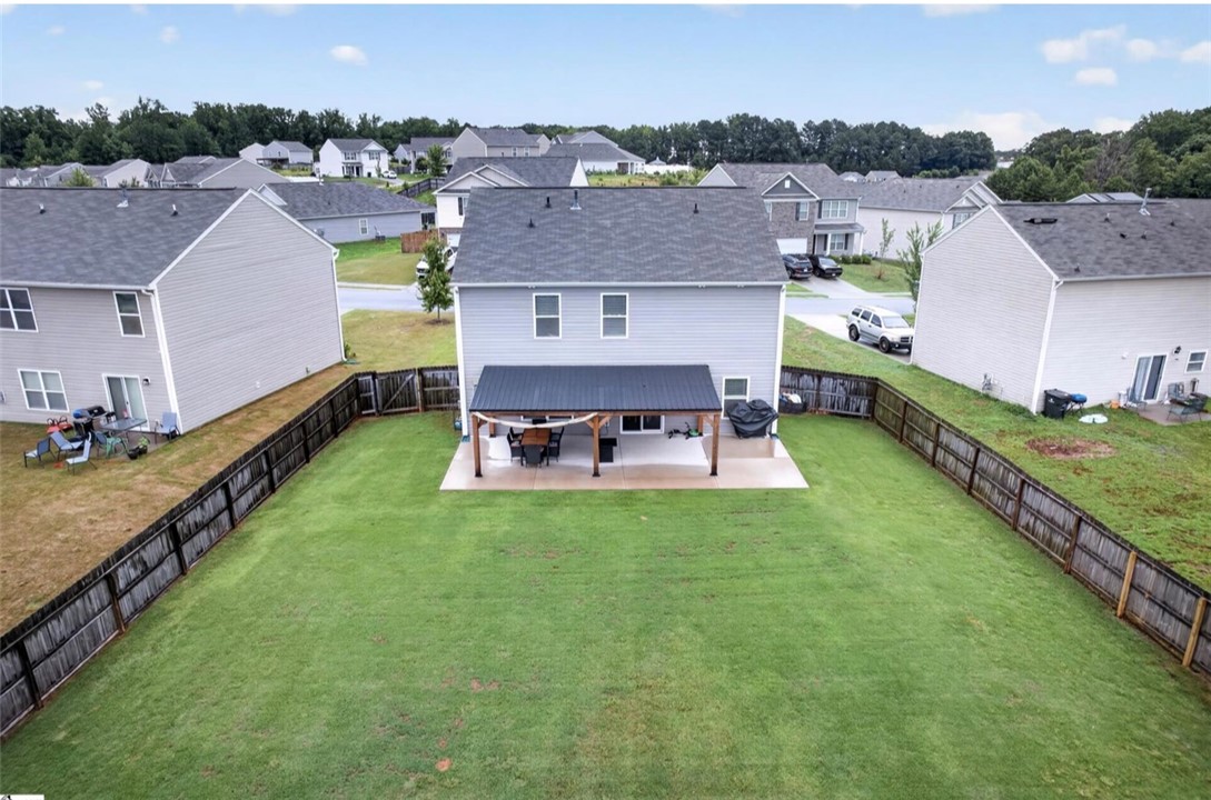 213 Millhone Way Pendleton, SC 29670 - Photo 19 of 25 Relax and entertain on the covered back patio overlooking a generous, fenced backyard.