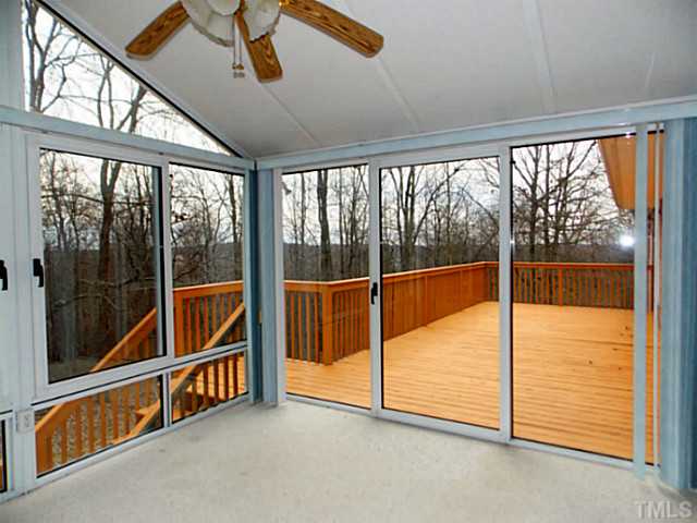 3768 Osceola Road Elon, NC 27244 - Photo 19 of 23 Large Deck Accessible from Heated and Cool Sunroom