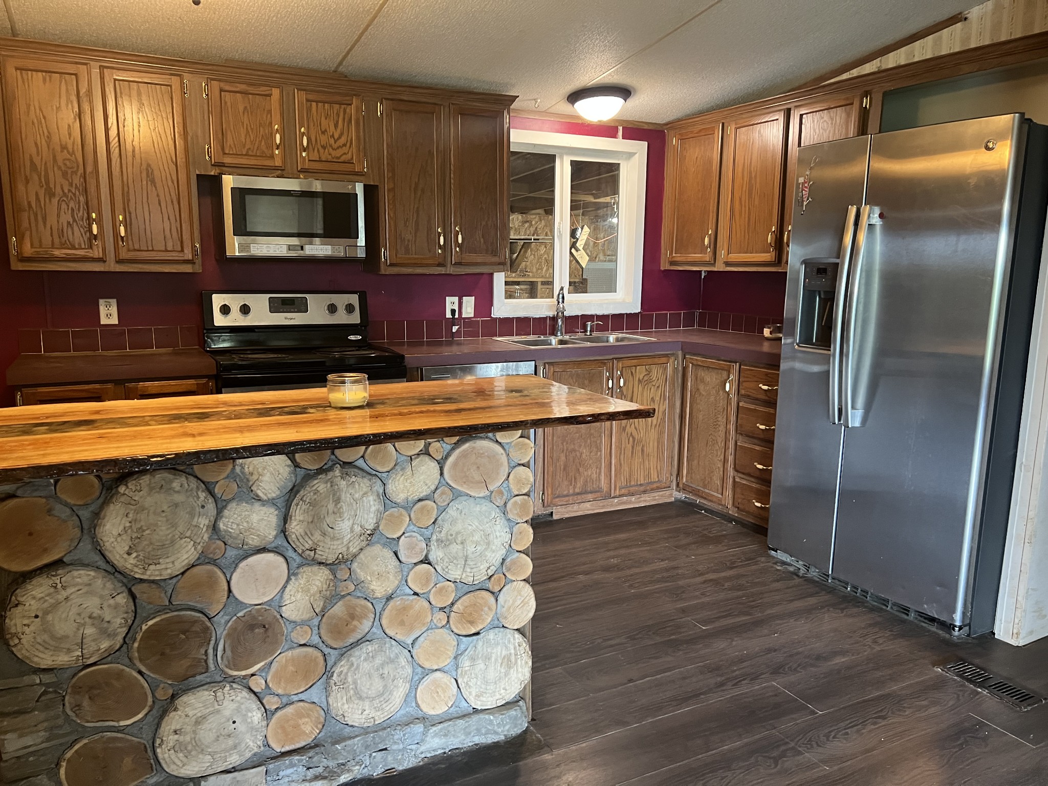 2999 Demastus Road Culleoka, TN 38451 - Photo 20 of 59 a kitchen with stainless steel appliances granite countertop a stove a sink and a microwave