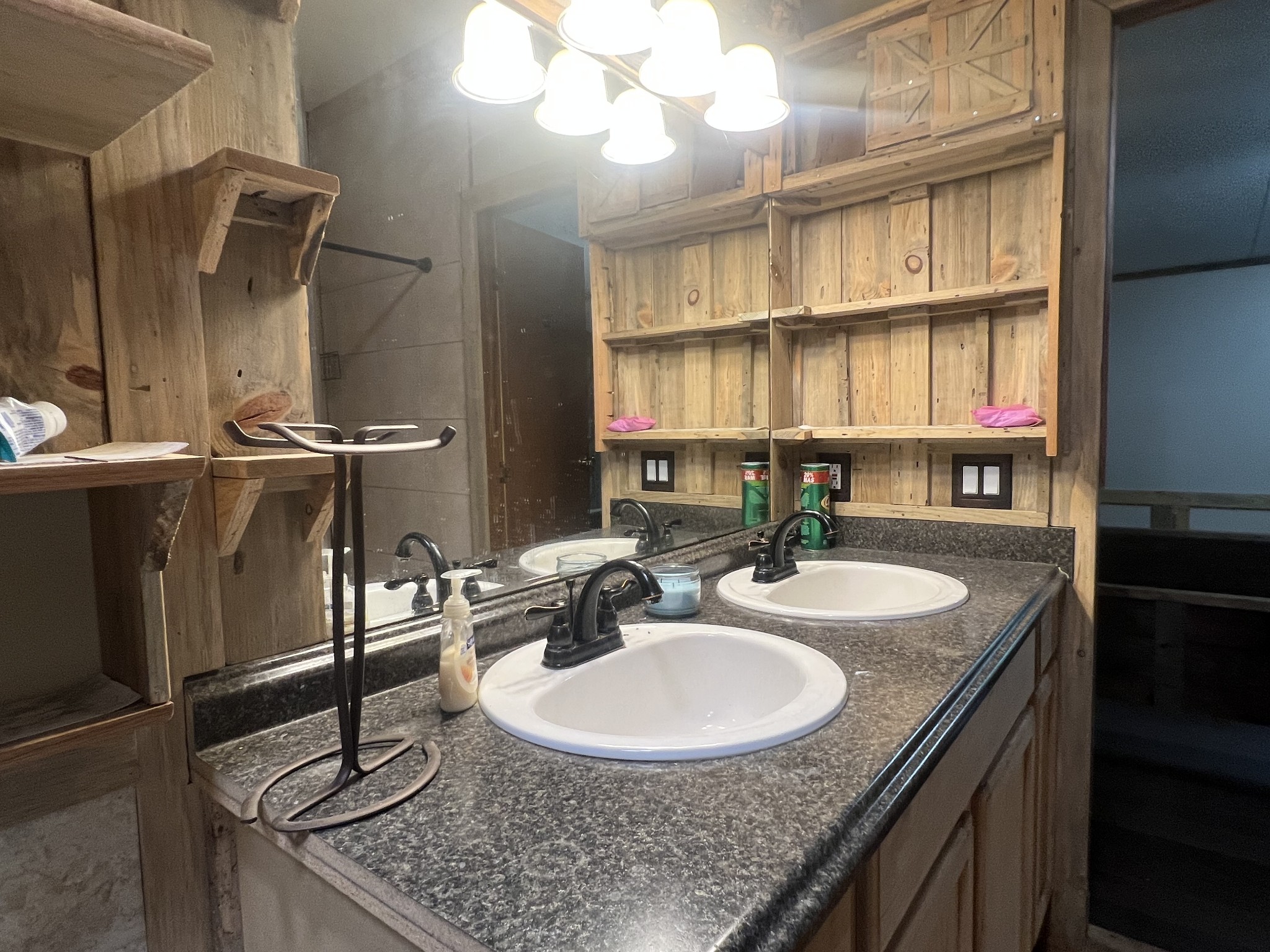 2999 Demastus Road Culleoka, TN 38451 - Photo 23 of 59 a bathroom with a granite countertop sink a mirror and a shower
