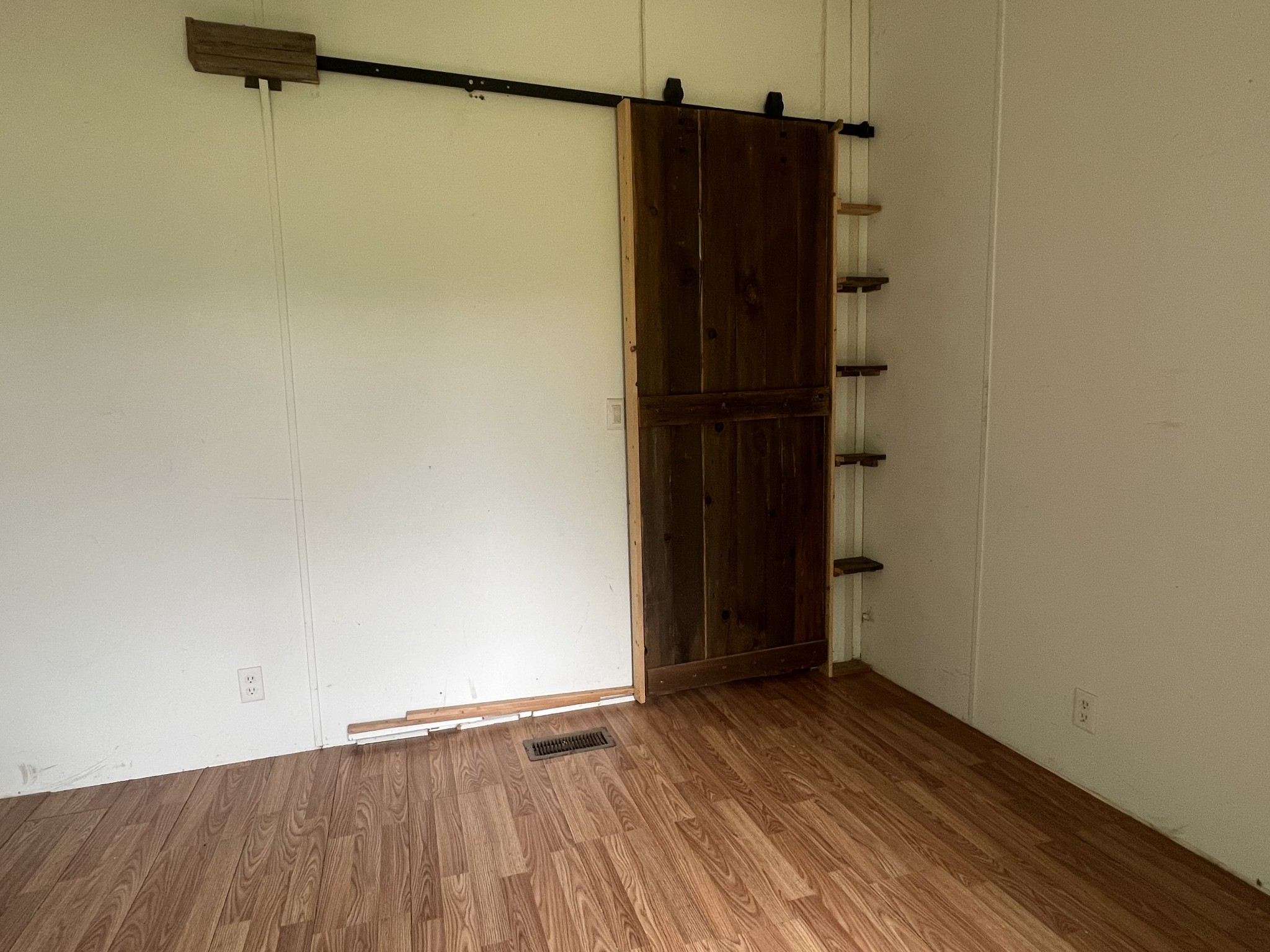 2999 Demastus Road Culleoka, TN 38451 - Photo 29 of 59 an empty room with wooden floor and cabinet
