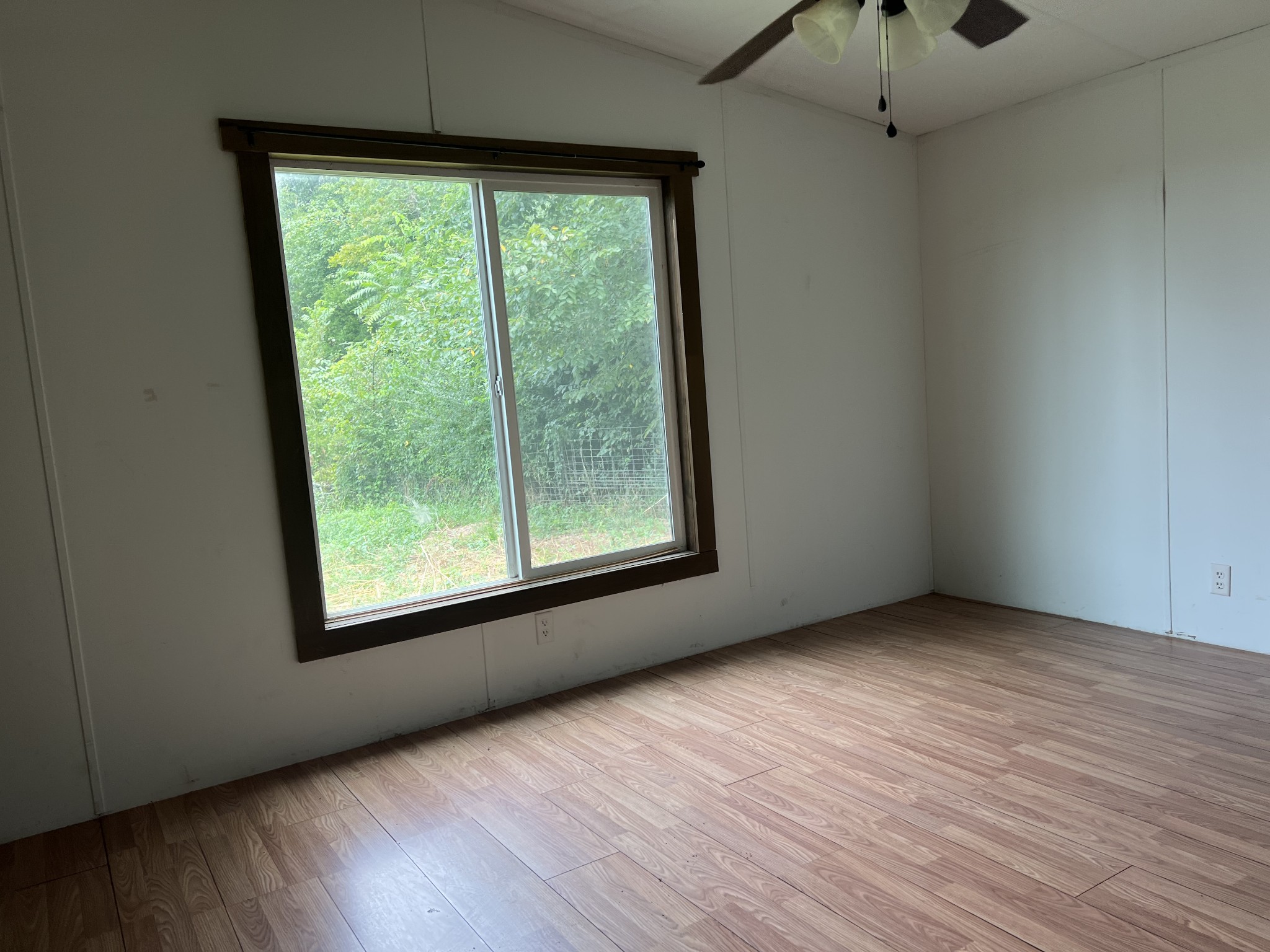 2999 Demastus Road Culleoka, TN 38451 - Photo 32 of 59 an empty room with wooden floor and windows