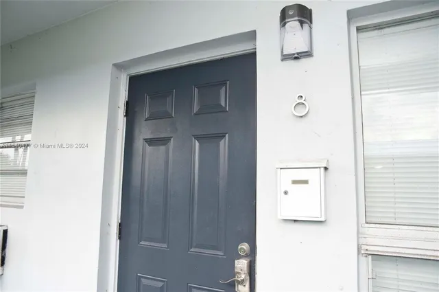 a picture of a bathroom with a shower