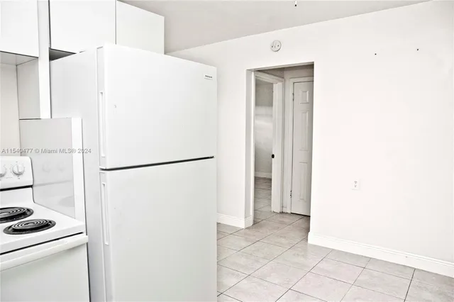 an empty room with a bench