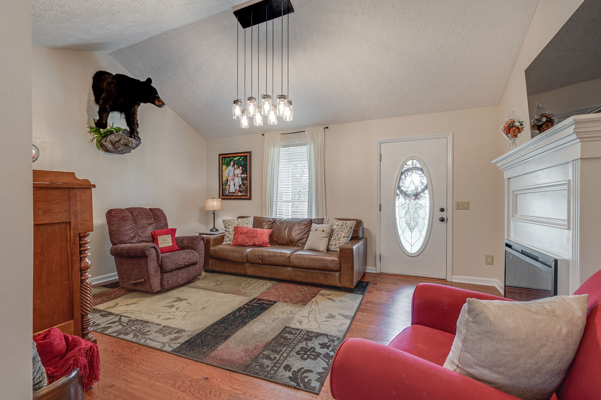1686 Mann Road Lebanon, TN 37087 - Photo 7 of 31 a living room with furniture a chandelier and a window
