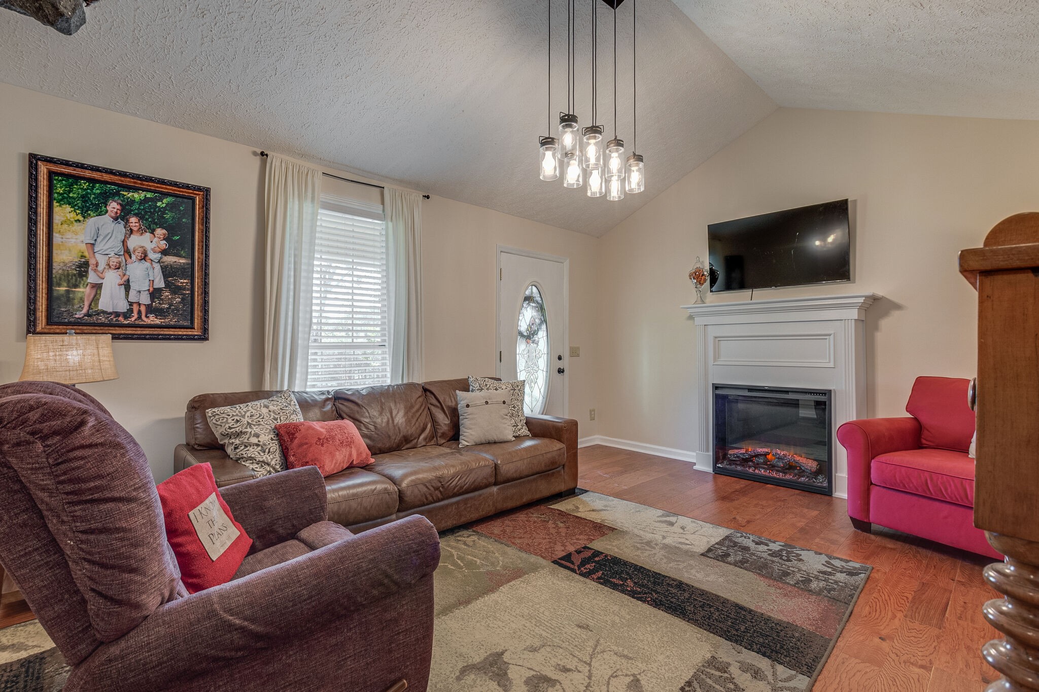 1686 Mann Road Lebanon, TN 37087 - Photo 8 of 31 a living room with furniture a fireplace and a flat screen tv