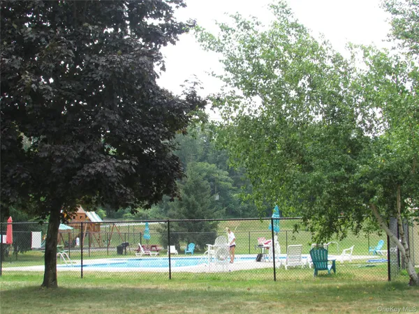 a view of a park with large trees