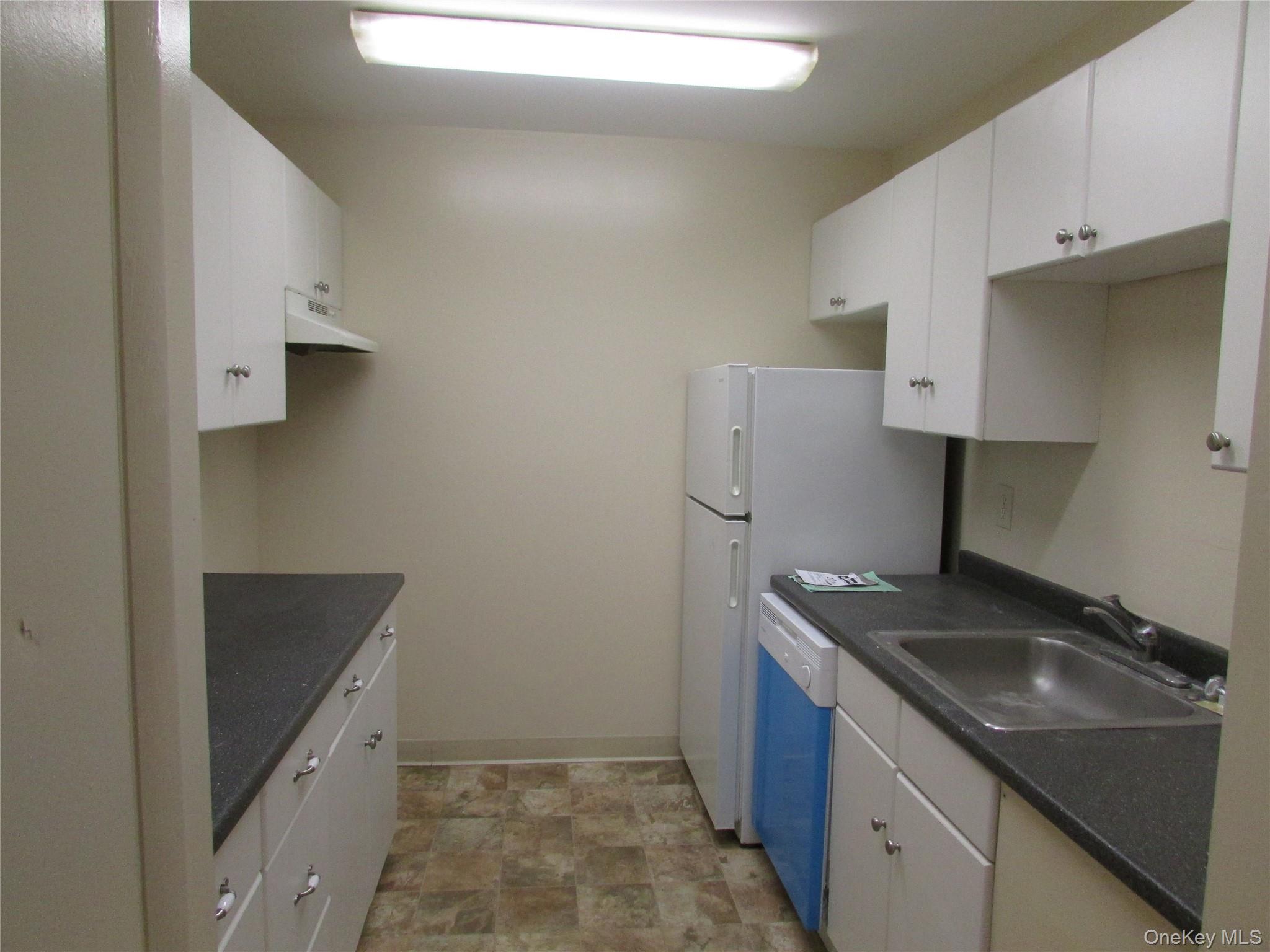 9 White Gate Road, Unit J Wappingers Falls, NY 12590 - Photo 5 of 17 Kitchen with white cabinetry, and dishwasher