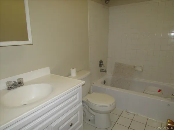 a bathroom with a sink a toilet and bathtub
