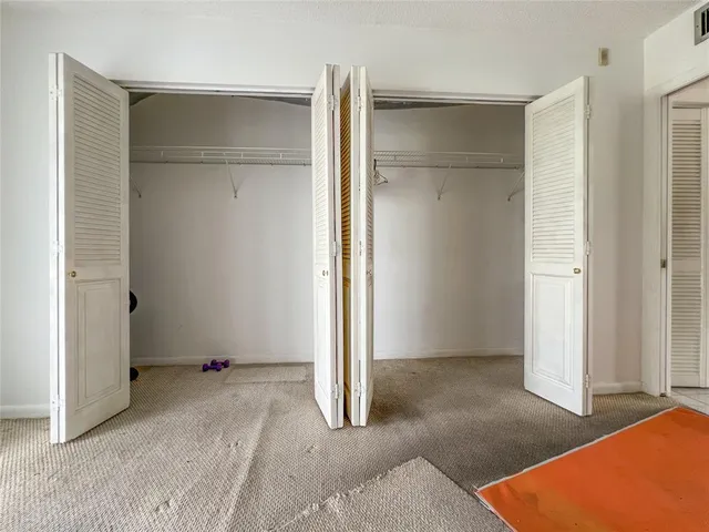 an empty room with closet