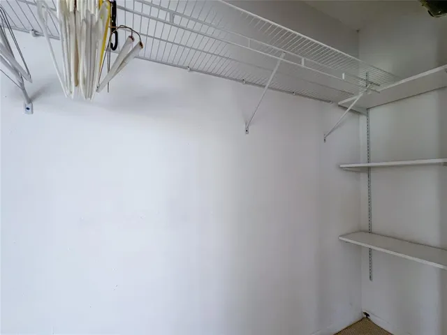 a view of a room with racks on the wall