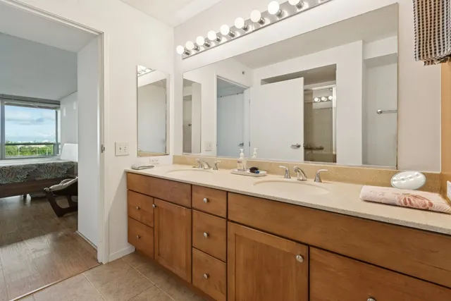 a bathroom with a double vanity sink and a mirror
