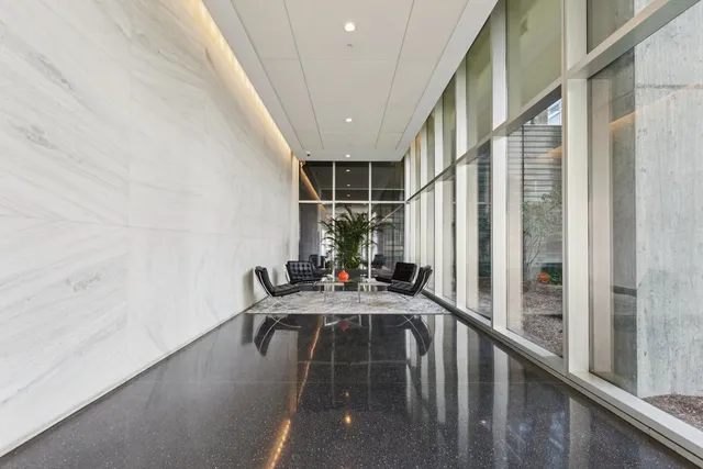 a view of balcony and dining room with furniture