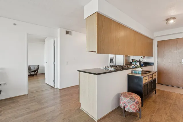 a kitchen with a sink and a stove top oven