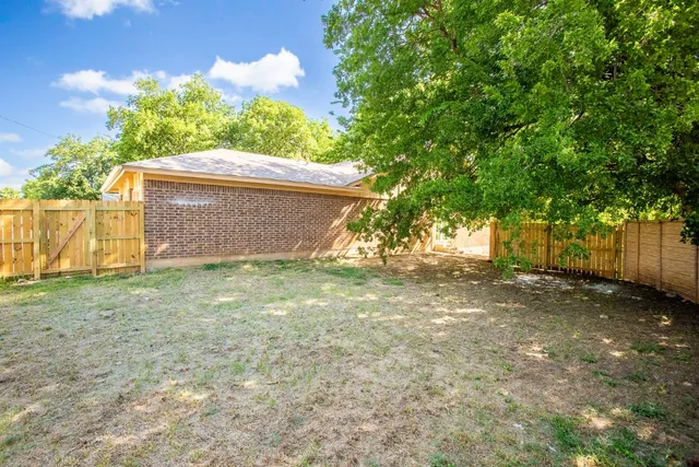 a backyard of a house with lots of green space